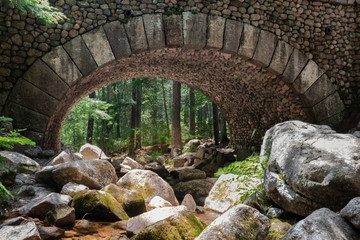 Bridge made from round rocks in Acadia National park, the first and only one of its kind, build in...