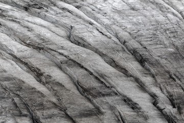 Surface of glacier ice with faults and fractures