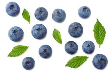 healthy background. blueberries with leaves isolated on white background. top view
