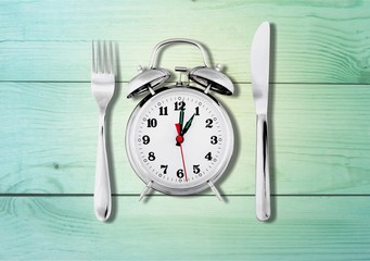 Alarm clock with knife and fork