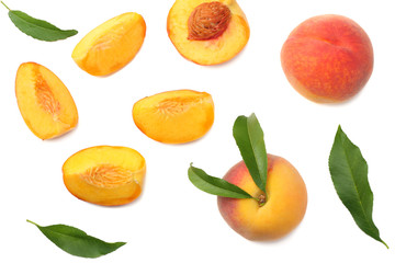 peach fruit with green leaf and slices isolated on white background. top view