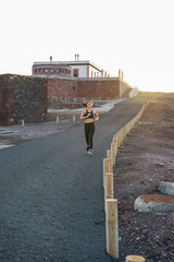 Long distance picture of a woman running