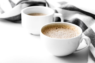 Cappuccino on a striped tablecloth. Morning coffee.