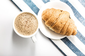 Cappuccino on a striped tablecloth. Morning coffee.