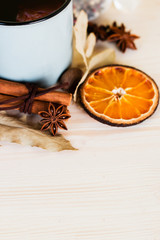 Autumn, fall leaves, hot steaming cup of glint wine