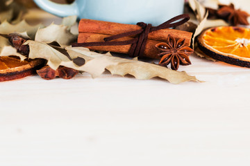 Autumn, fall leaves, hot steaming cup of glint wine