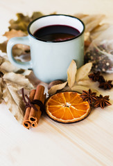 Autumn, fall leaves, hot steaming cup of glint wine