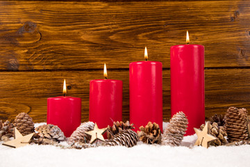 advent candles with pinecone