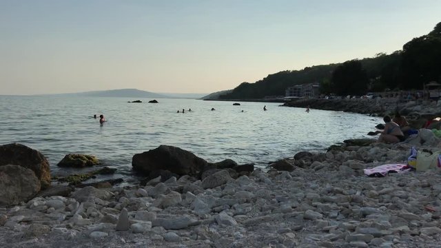 People chatting on the Beach - Balchik, Bulgaria