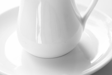 Detail of a cup of tea and a plate