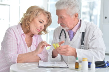 Senior doctor with elderly patient