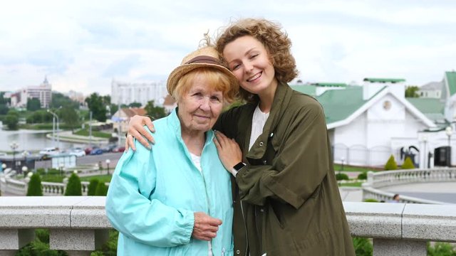 Happy Grandmother With Granddaughter Outdoors Portrait