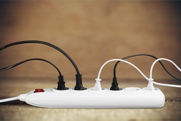 Socket strip and connected plugs on  background