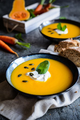 Pumpkin and carrot soup with sour cream
