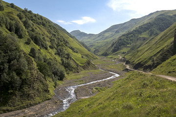 The river flowing between the mountains beyond the pass on the road to Shatili