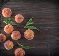 ripe peaches and green leaves