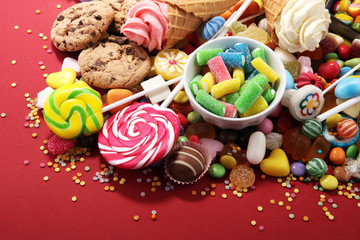 candies with jelly and sugar. colorful array of different childs sweets and treats