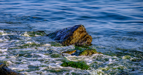 Waves and stones on the beach in Istanbul