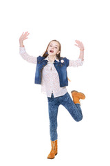 Happy little girl in jeans posing 