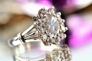 Close-up of silver ring with diamonds - jewelery, warm color balance