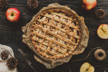 Homemade delicious apple pie on the wooden table. Top view - obrazy, fototapety, plakaty