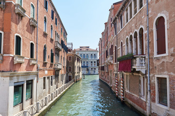 Scenic canal with colorful ancient buildings in Venice, Italy. Sommer.