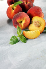 A group of ripe peaches on table