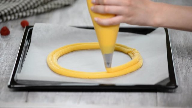 Eclair rings baking process. Making Paris Brest