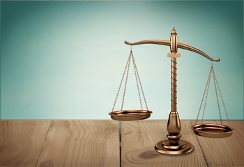 Law scales on table background