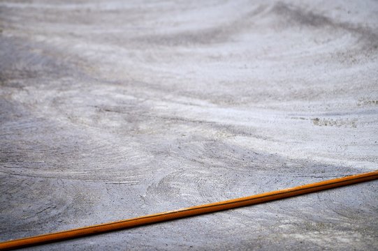 Hosepipe over new dried concrete