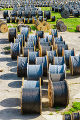electricity cable on wooden spools on the floor