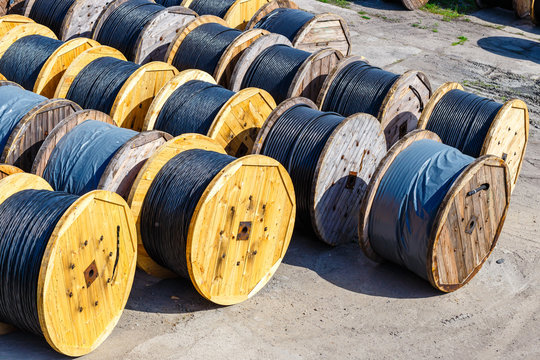electricity cable on wooden spools on the floor