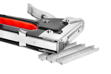 Construction metal stapler and staples on a white background, isolated