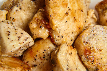 pieces of fried chicken fillet sprinkled with black pepper