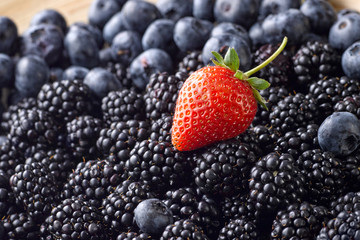 background of fresh organic blackberries and strawberries
