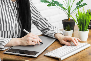 Modern designer sitting in front of computer in office