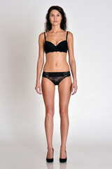 Woman in underwear full lengh in front position