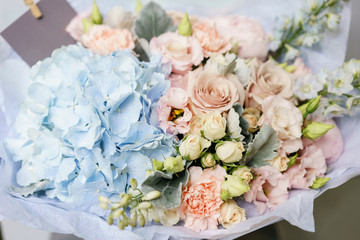 Beautiful summer bouquet. Arrangement with mix flowers. The concept of a flower shop. Work florist.