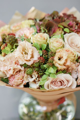 Floral Arrangement. Mix flowers. Beautiful summer bouquet. Concept of a flower shop. Profession florist