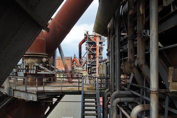 Detail of old rusty structural industrail factory. Concrete and steel structure of abandon former ironworks. Interior of rusty abandon factory atmosphere.