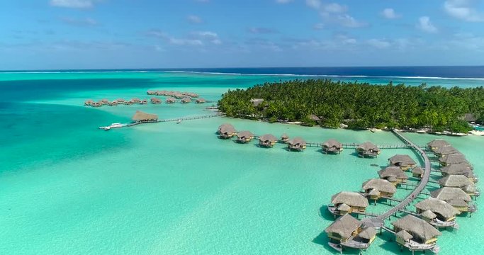 Water bungalows resort at islands, french polynesia in aerial view