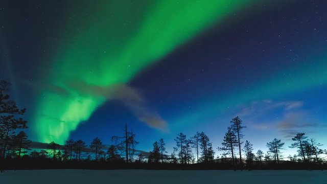 Time lapse of northern lights dancing on the sky in Lapland Finland.