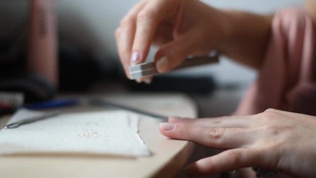 Prepairing nails to polish them with long lasting nail polish.