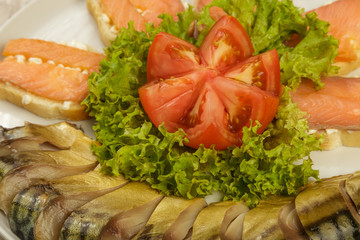 Sliced herring on a plate with herbs.
