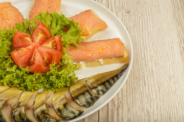 Sliced herring on a plate with herbs.