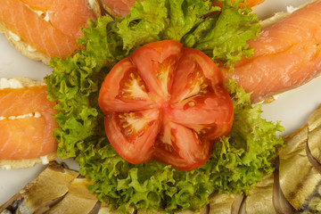 Sliced herring on a plate with herbs.