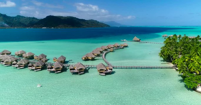 Water bungalows resort at islands, french polynesia in aerial view