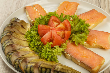 Sliced herring on a plate with herbs.