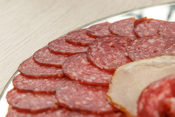 Sausage cuts of different varieties on a plate.