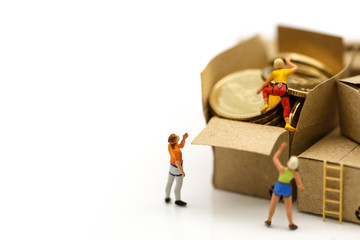 Miniature people : climbers team climbing on box of coins,Business travel concept.